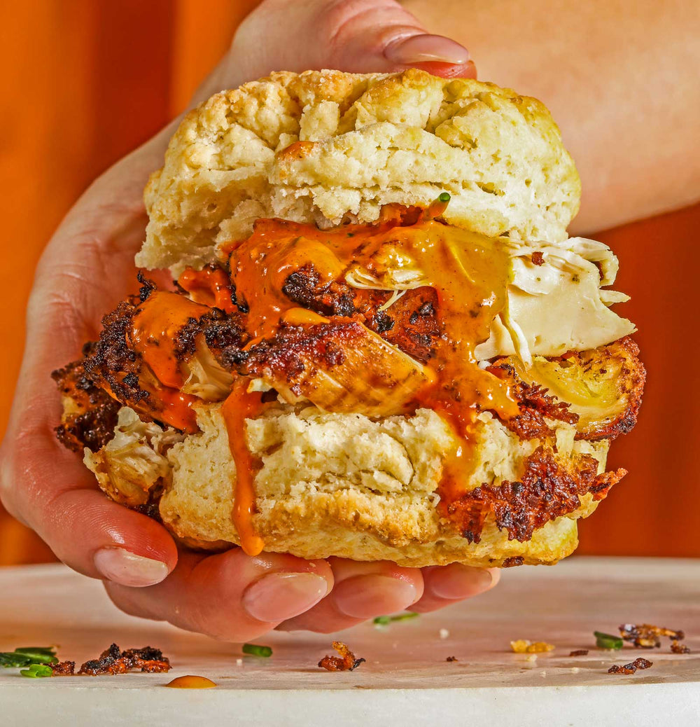 Yellowbird Bliss & Vinegar Hot Sauce on a grilled chicken