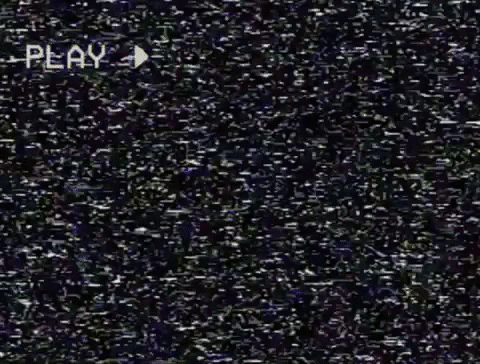 A short video clip of VHS screen white noise static that appears between longer video clips