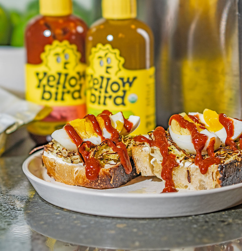 Yellowbird Organic Sriracha Hot Sauce drizzled onto breakfast egg toast